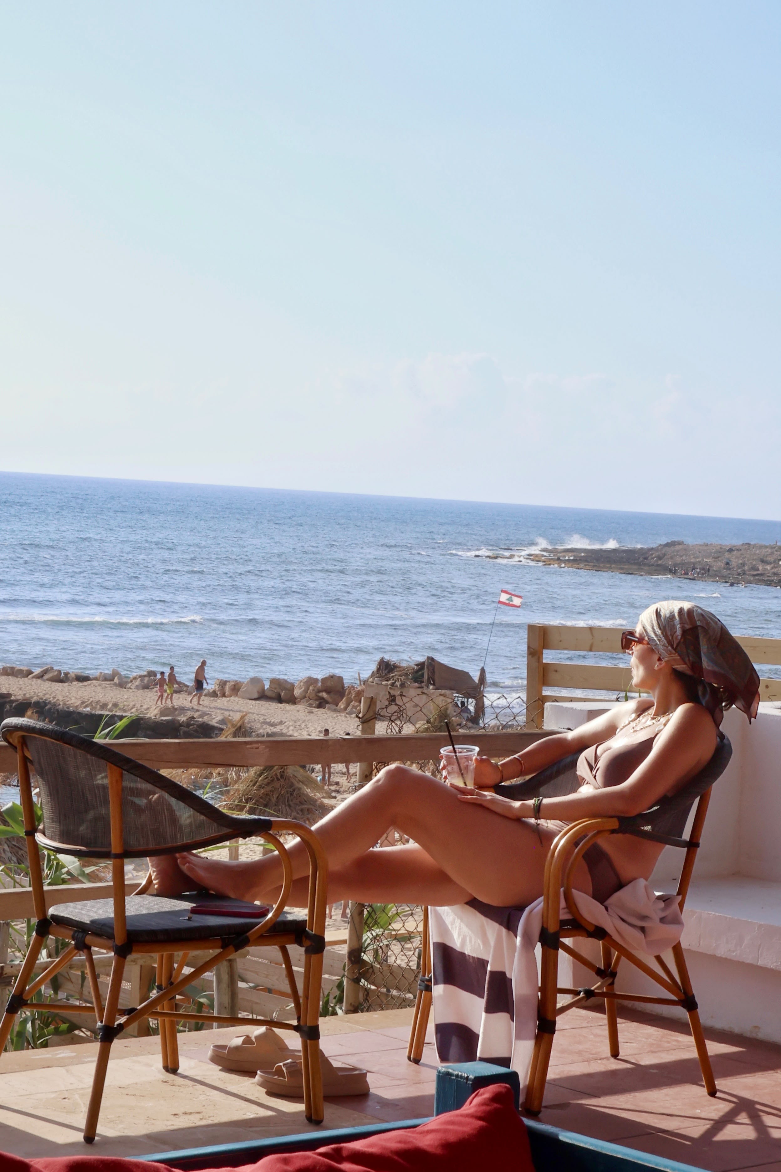 Guest relaxing at the Side B restaurant terrace with sea view
